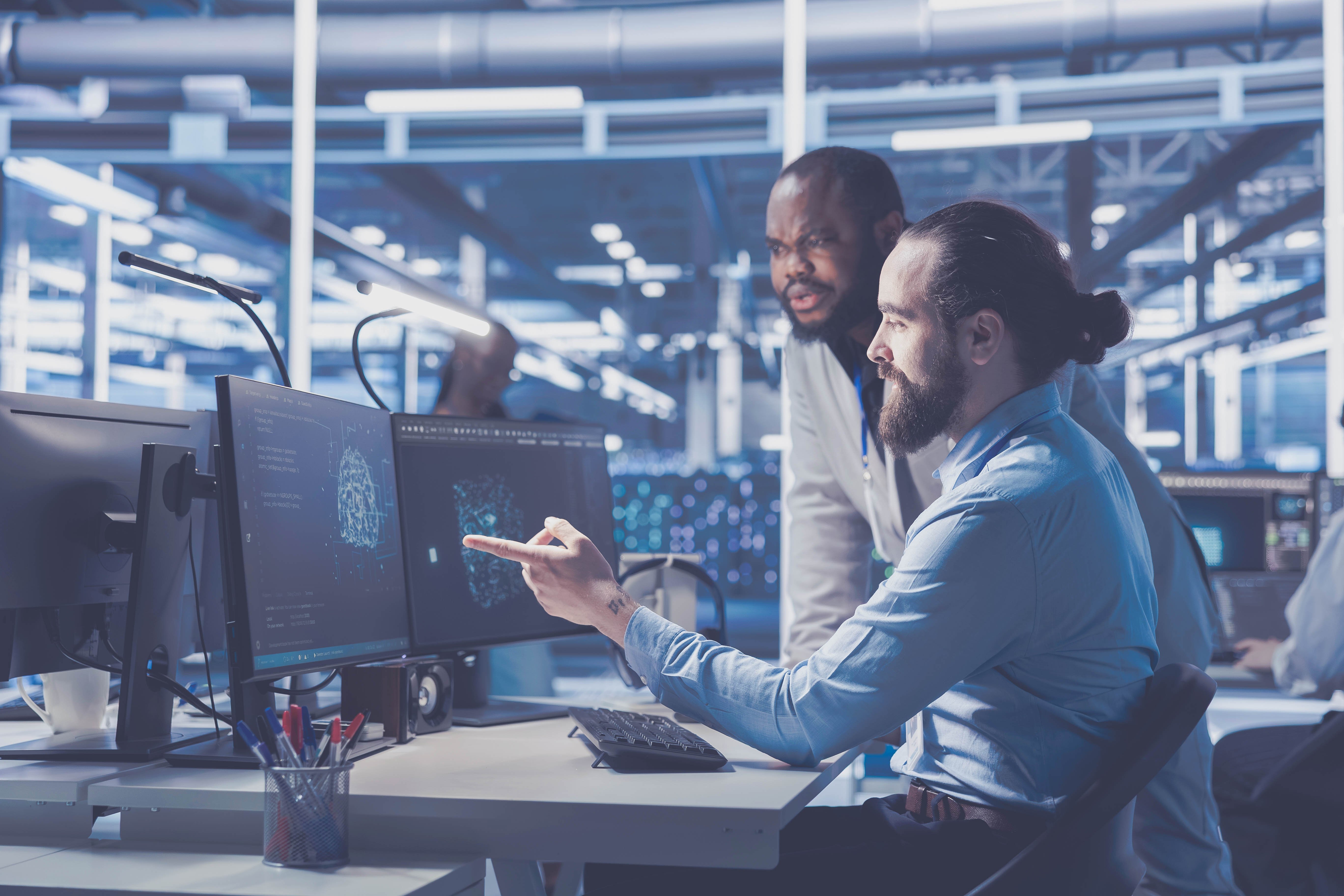 workers looking at computer monitors