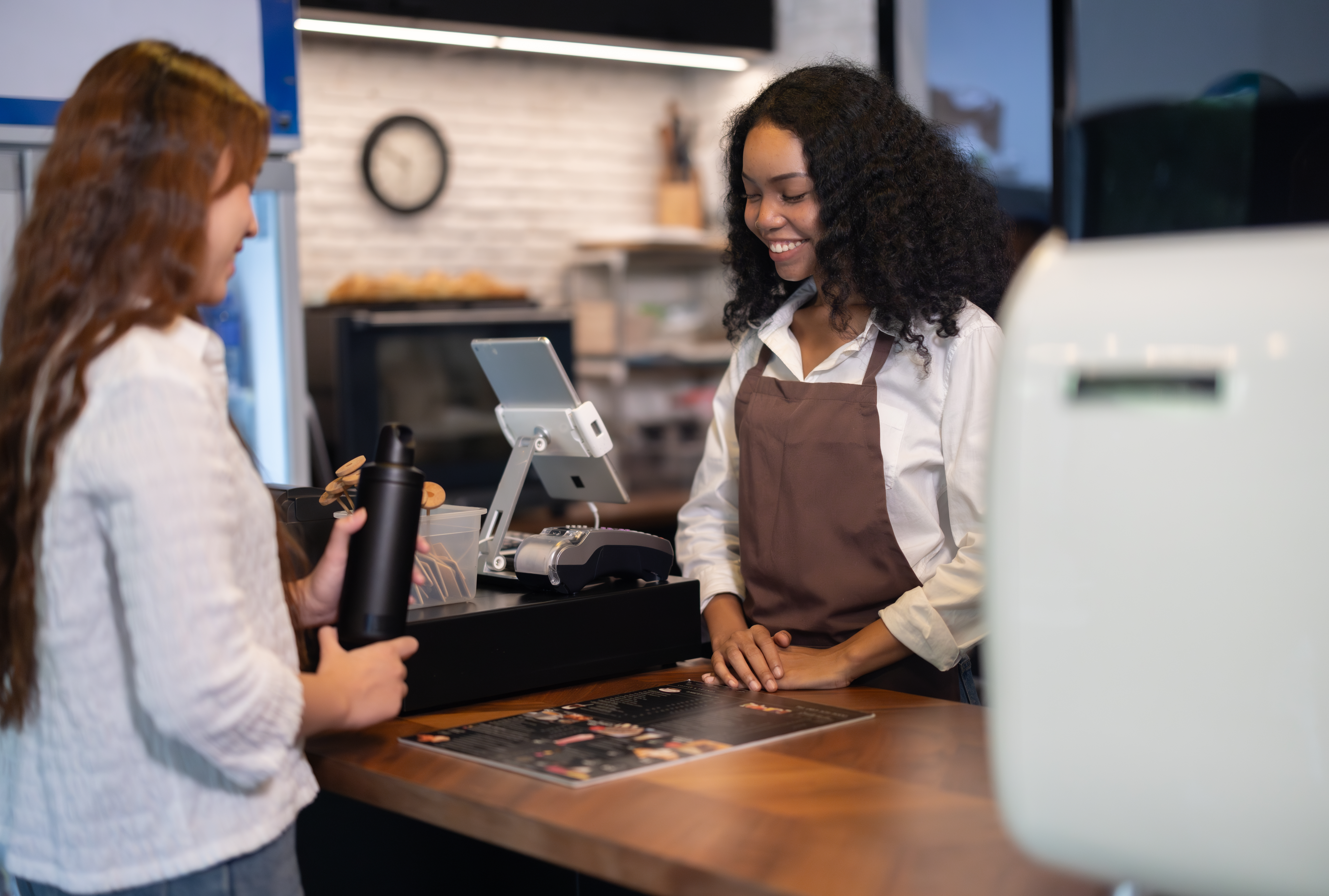 retail cashier checking out customer